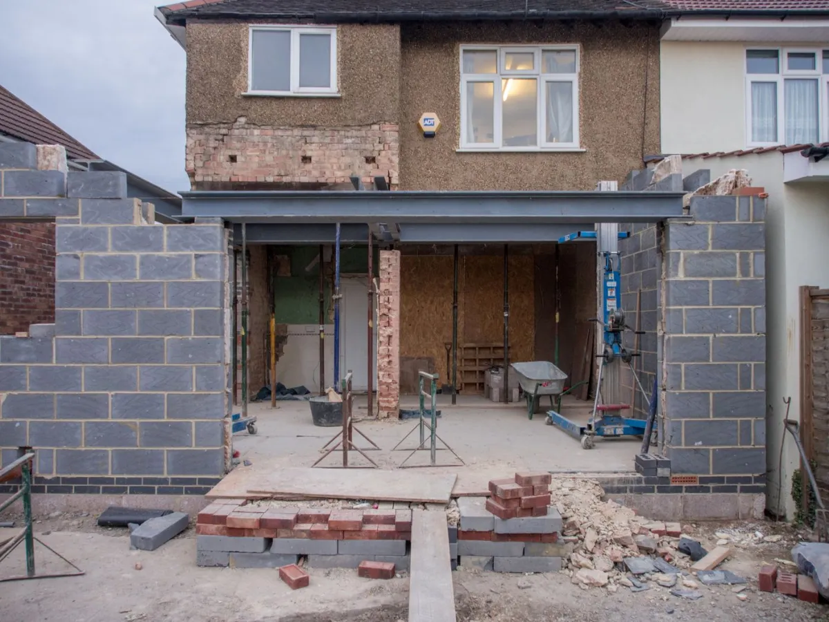 Single-storey rear extension under construction on a British semi-detached house